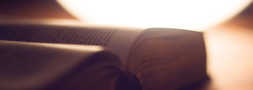 An open bible with light shining on it